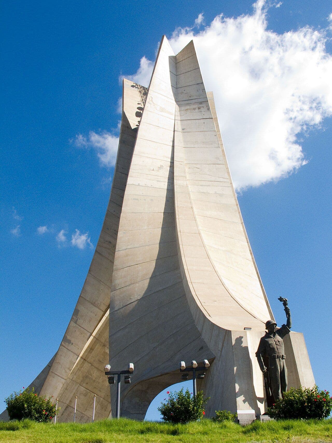Maqam Echahid, the Martyrs' Memorial in Algiers, rising into a blue sky